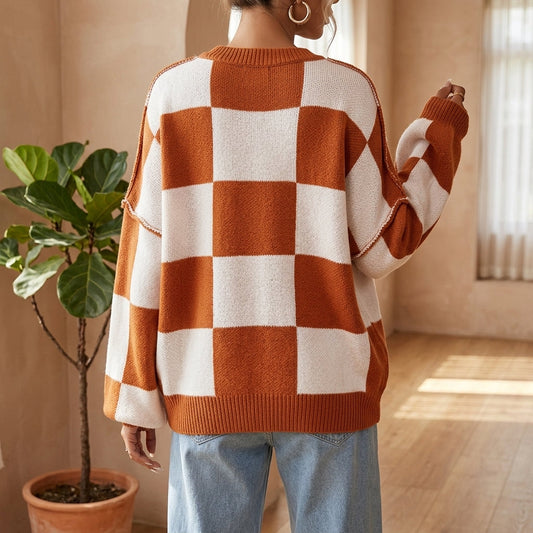 Model wearing orange checkerboard sweater