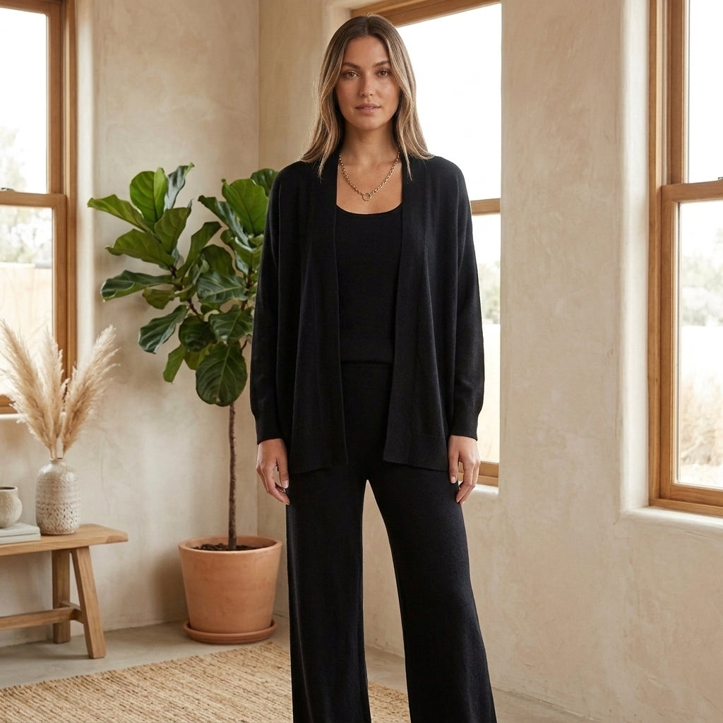Model wearing black three-piece loungewear set