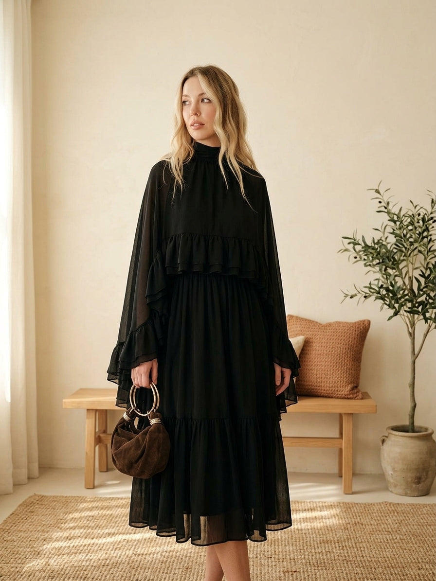 Model wearing black ruffle mock neck dress
