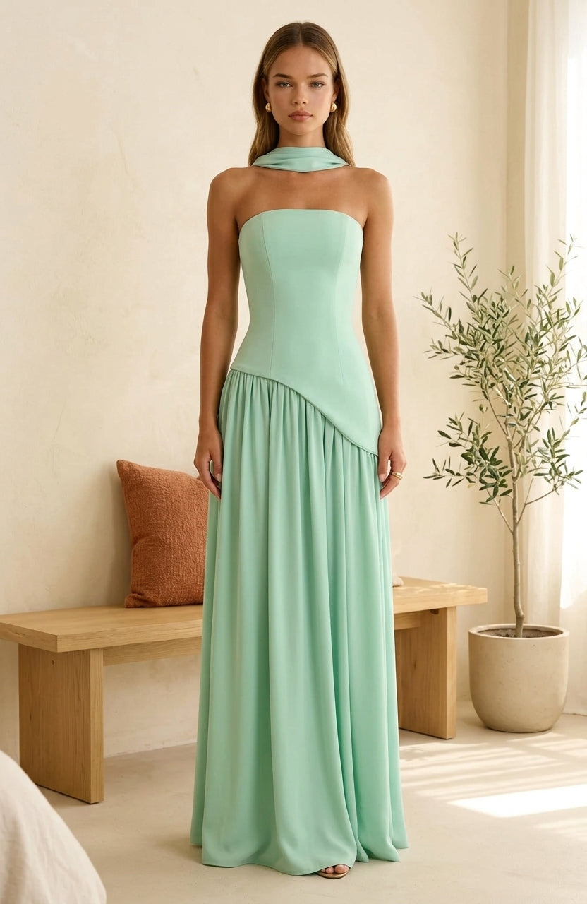 Model wearing mint maxi dress with draped neckline