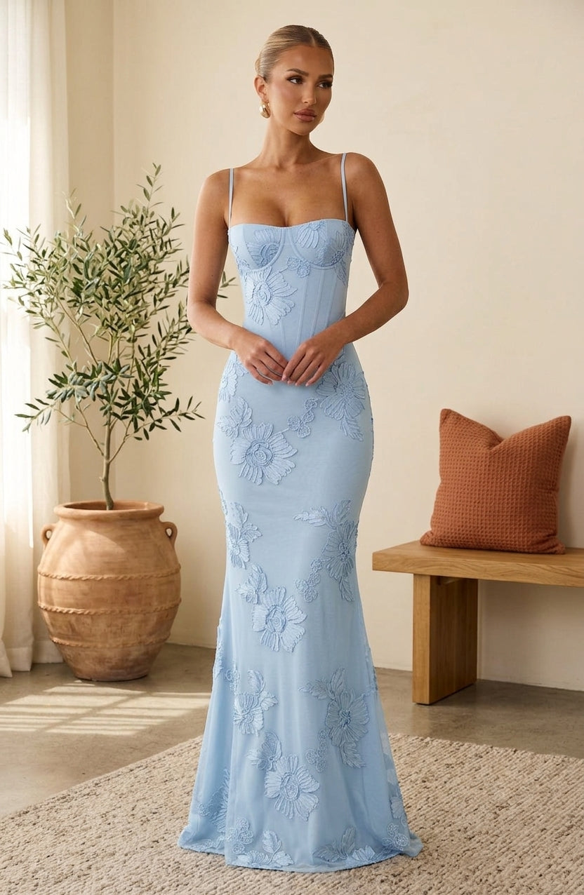 Model wearing light blue floral corset maxi dress