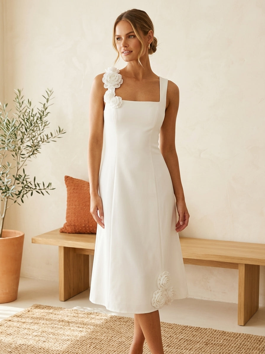 Model wearing white floral appliqué dress