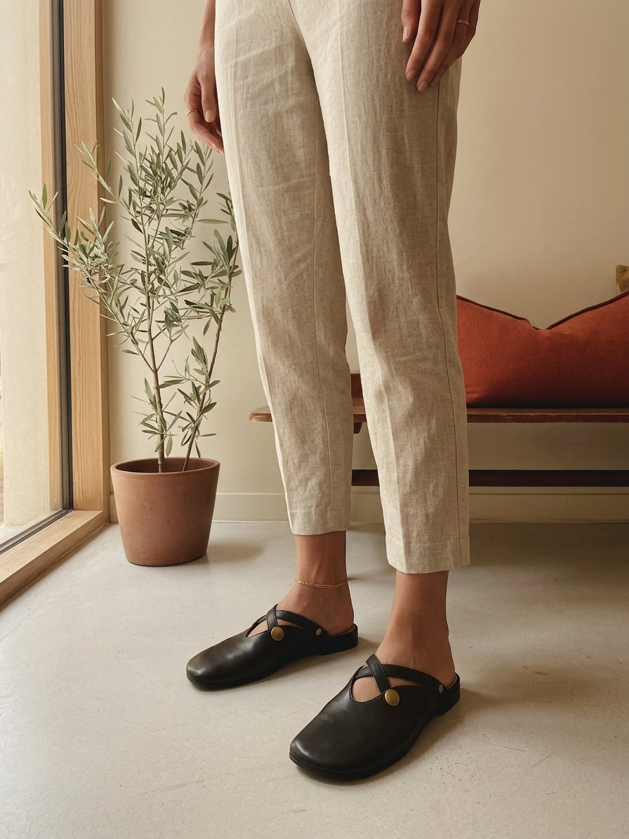 Model wearing black orthopedic flat shoes