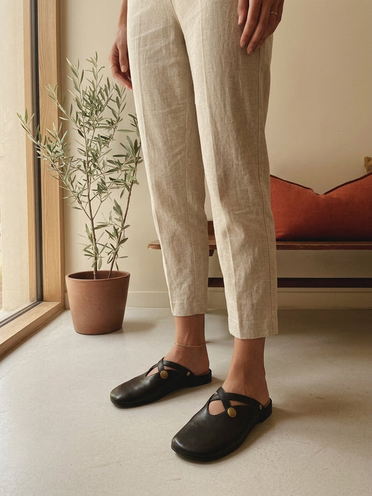 Model wearing black orthopedic flat shoes