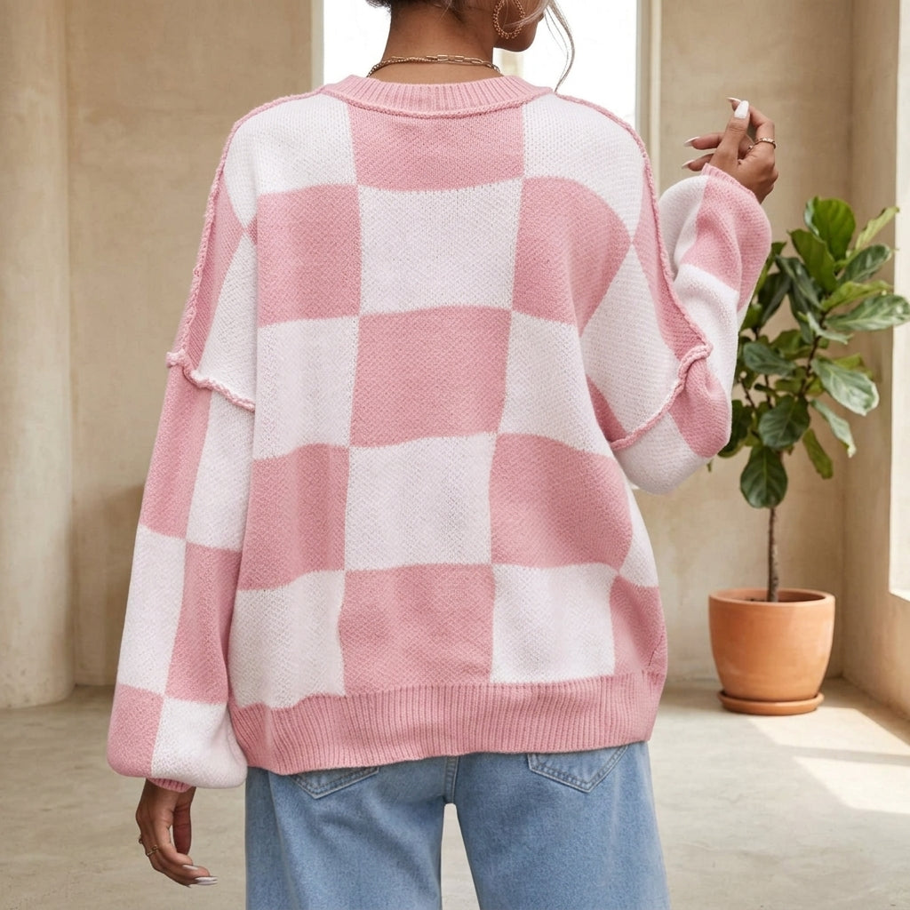 Model wearing baby pink checkerboard sweater