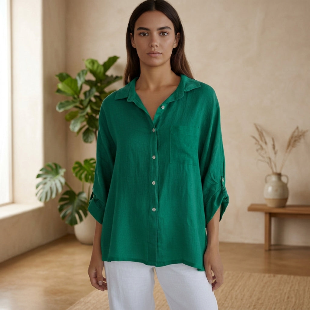 Model wearing malachite green linen blouse