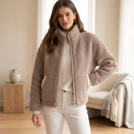 Model wearing beige oversized fleece jacket