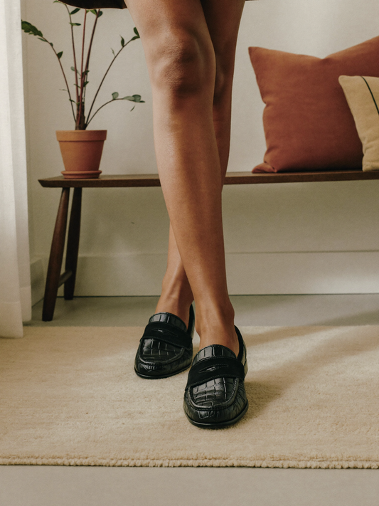 Model wearing formal black shoes