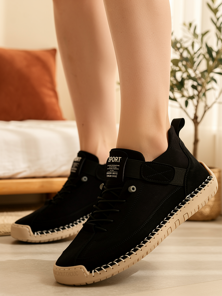 Model wearing black Mia sneakers