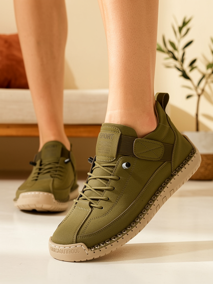 Model wearing khaki Mia sneakers