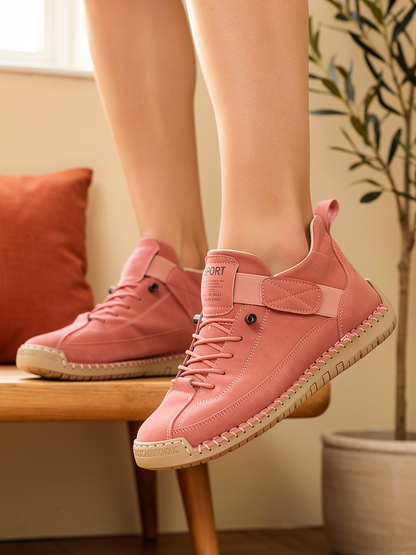 Model wearing pink Mia sneakers