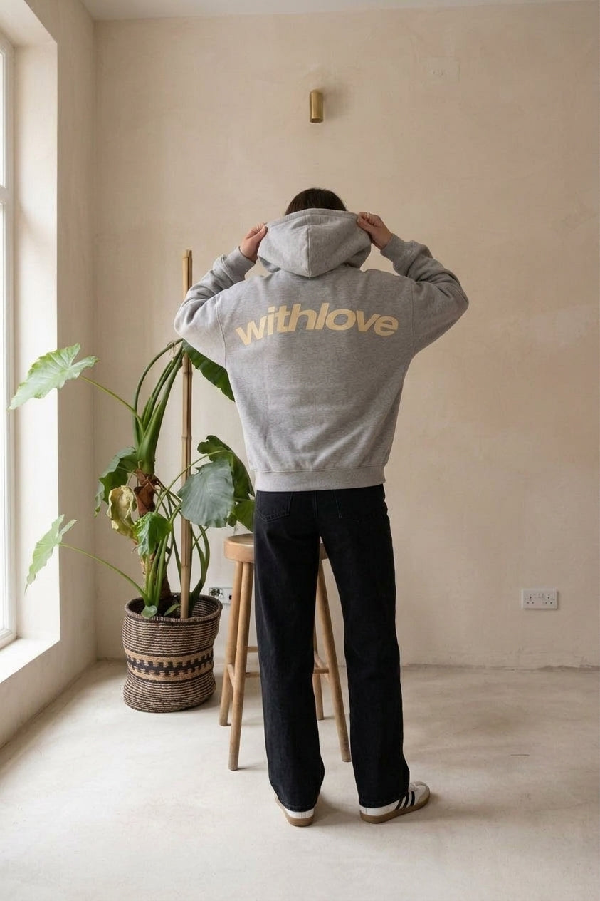 Model wearing gray oversized hoodie