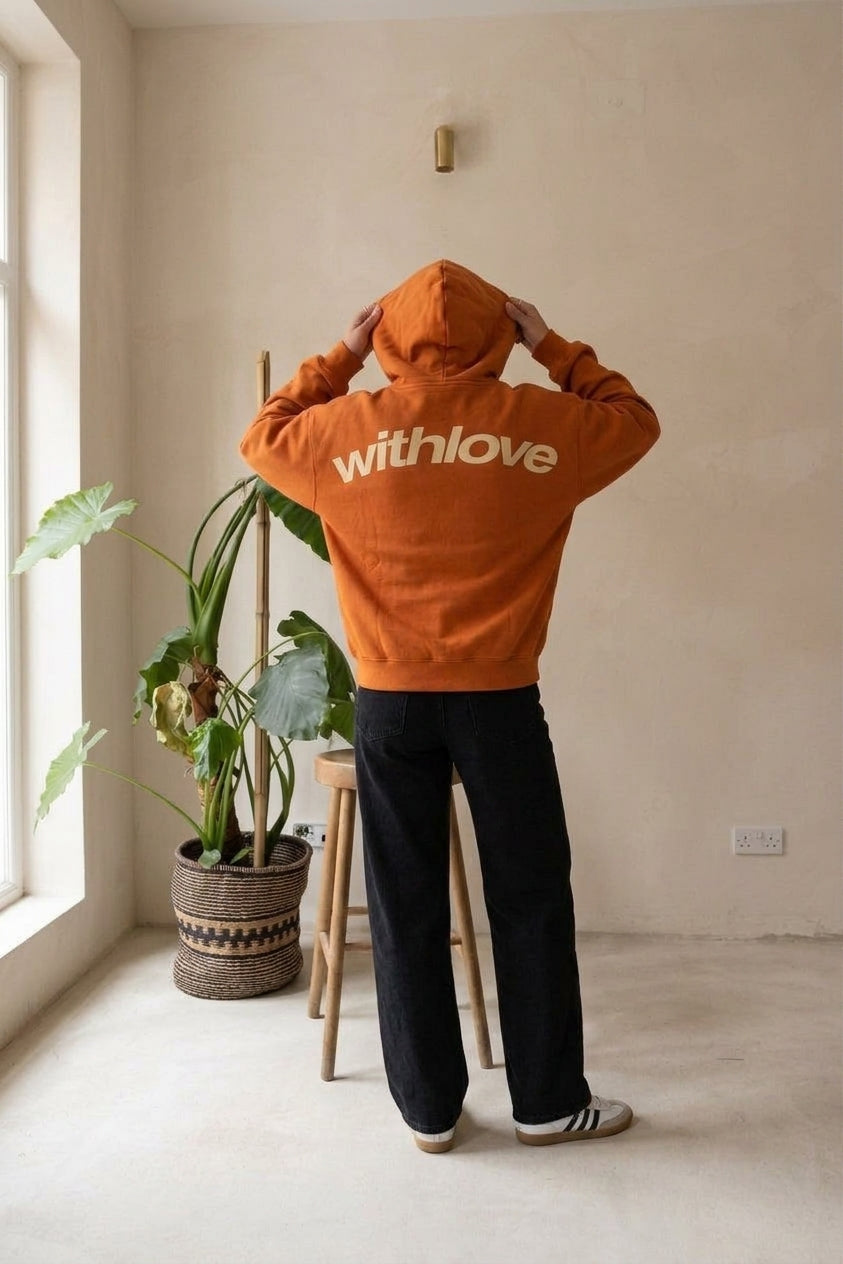 Model wearing orange oversized hoodie