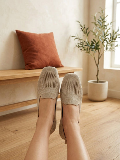 Model wearing beige knit slip-on flats