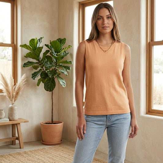 Model wearing apricot knit crew neck tank top