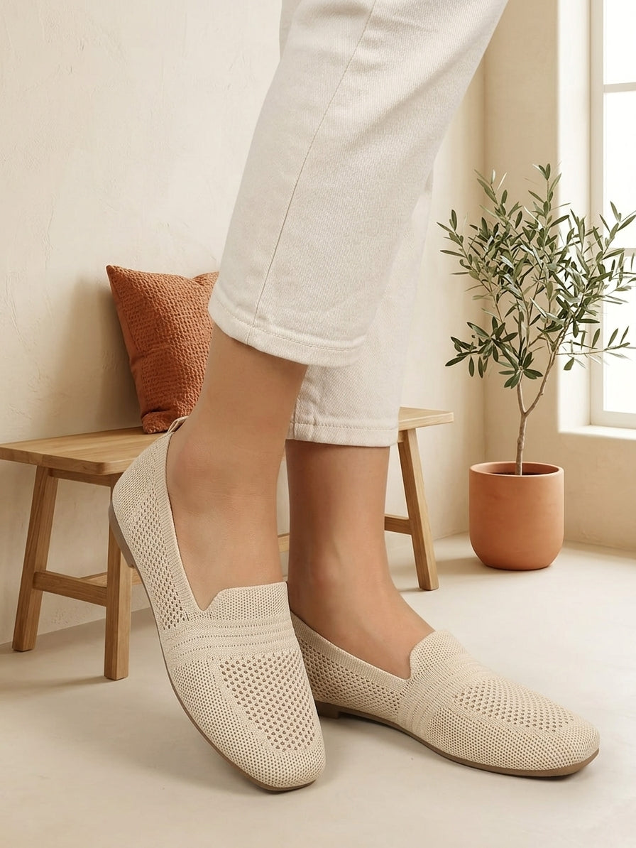 Model wearing light beige knit slip-on flats