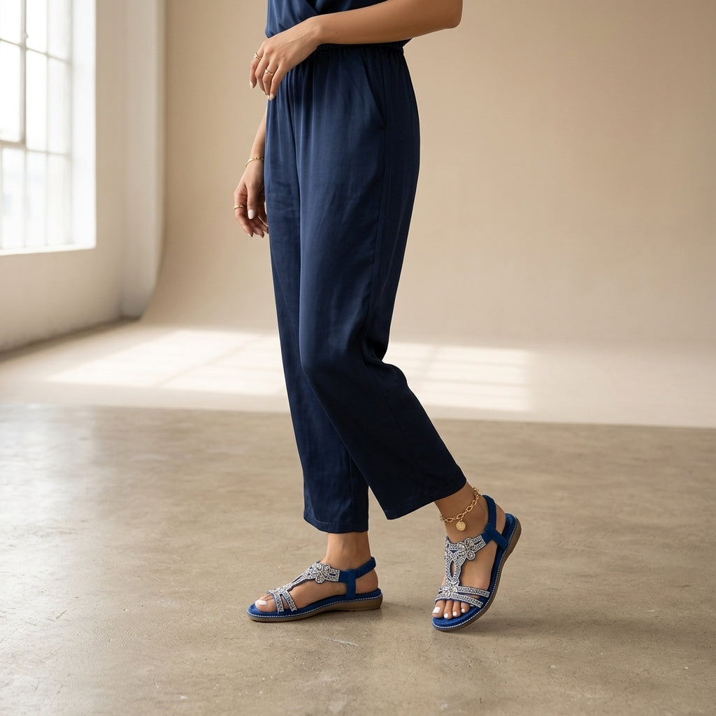 Model wearing blue orthopedic sandals