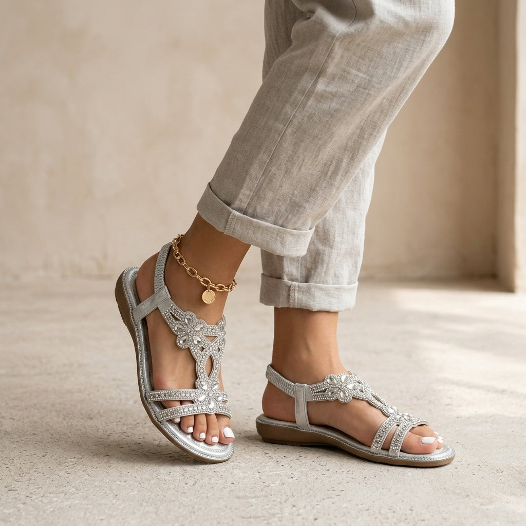 Model wearing silver orthopedic sandals
