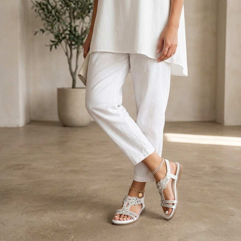 Model wearing white orthopedic sandals