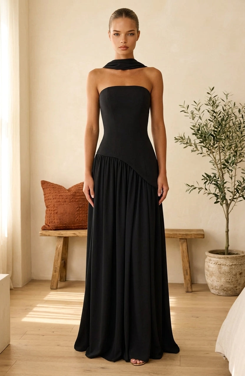 Model wearing black maxi dress with draped neckline