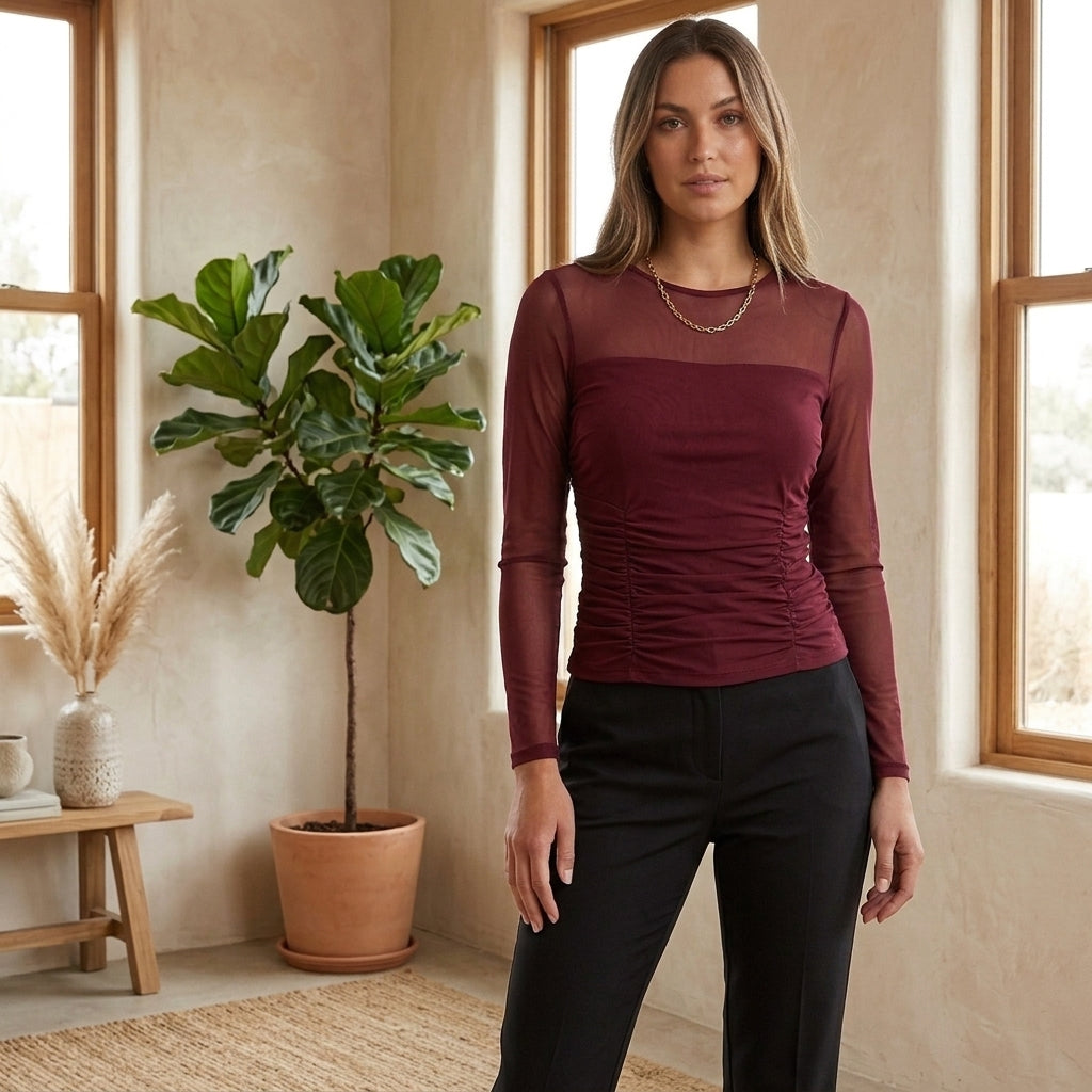 Model wearing wine red sheer mesh long sleeve top