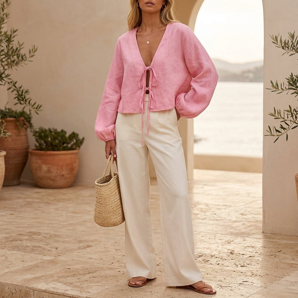 Model wearing pink linen front-tie top