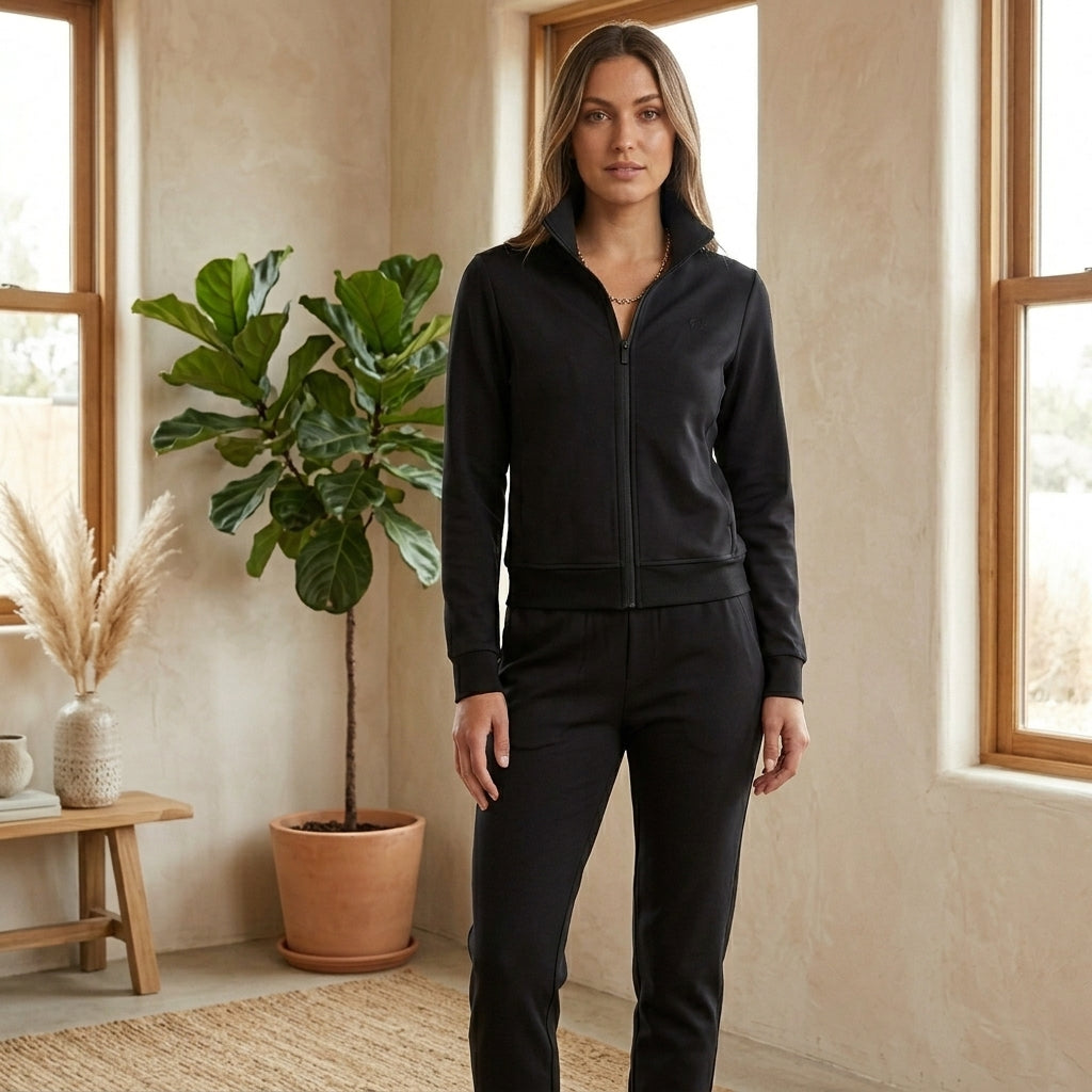 Model wearing black tracksuit set